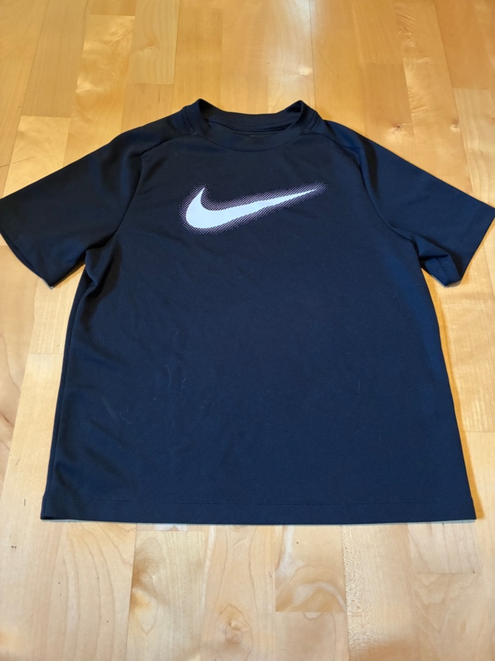 Nike Black Short Sleeve quick dry Tee with White Swoosh Accent Youth Medium